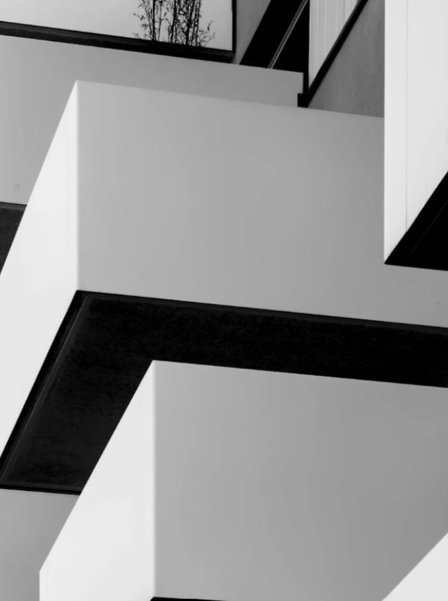 Stacked white balconies on a modern building